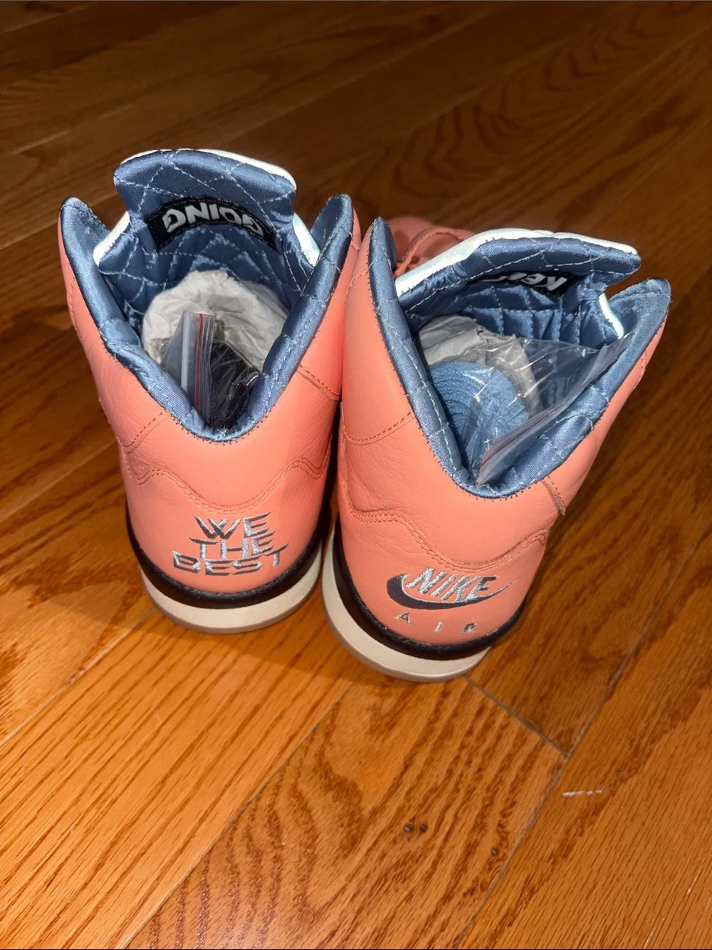 Nike men’s Coral Pink and Light Blue High-Top Sneakers